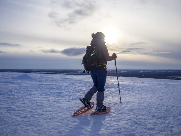 pretty young woman snowshoeing and enjoying splen 2022 06 24 11 29 48 utc scaled